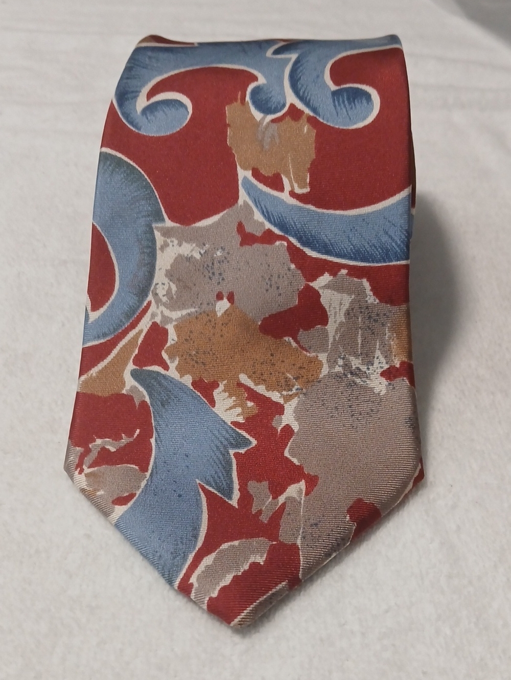 Classic Red Patterned Men's Tie with Blue and Tan Motifs